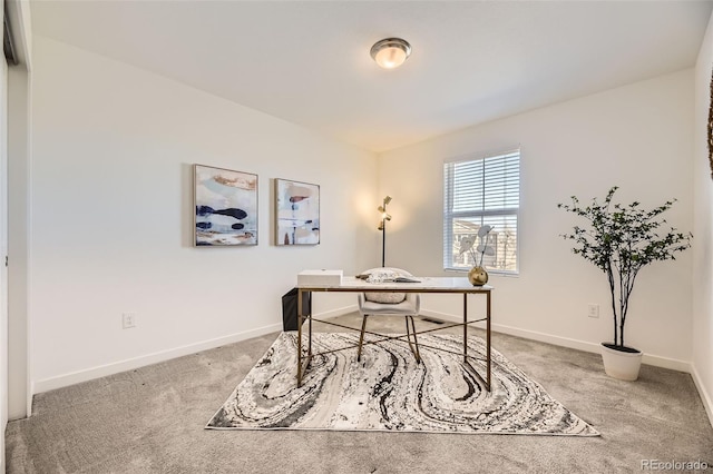 carpeted office with baseboards