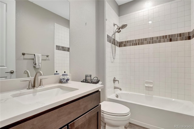 full bath with toilet, vanity, and washtub / shower combination