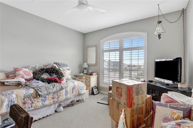 carpeted bedroom with ceiling fan