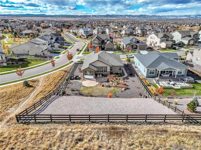 drone / aerial view featuring a mountain view and a residential view