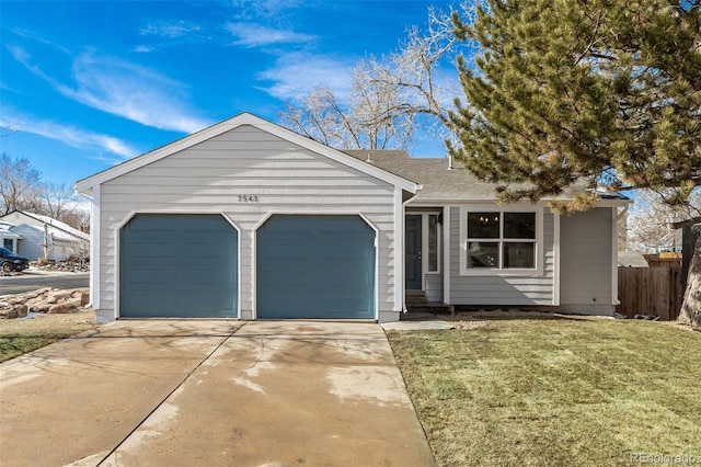 single story home featuring a garage and a front yard