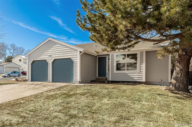 ranch-style house with a garage and a front yard