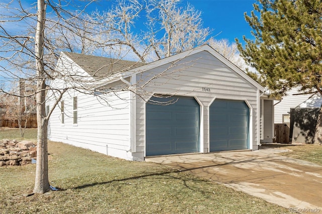 garage featuring a lawn