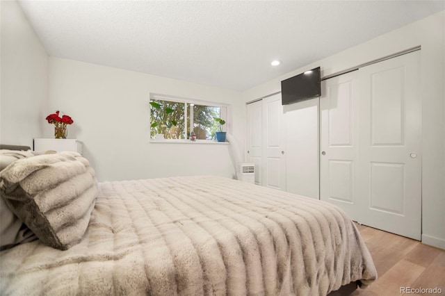 4068 S Atchison Way Unit 103, Aurora, CO 80014 - bedroom with light wood-style floors and recessed lighting