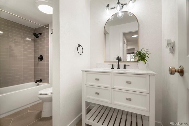 4068 S Atchison Way Unit 103, Aurora, CO 80014 - bathroom featuring toilet, vanity, bathtub / shower combination, and tile patterned flooring