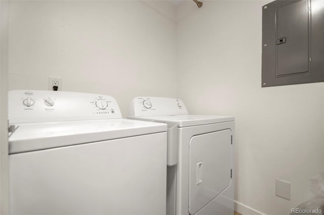 4068 S Atchison Way Unit 103, Aurora, CO 80014 - washroom with electric panel, washing machine and dryer, and baseboards
