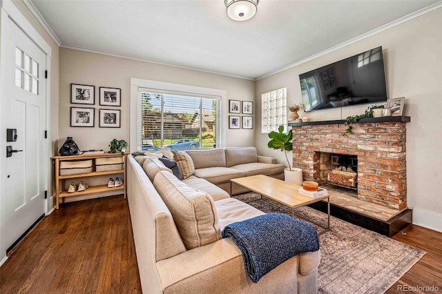 living room featuring crown molding, a brick fireplace, and dark hardwood / wood-style floors