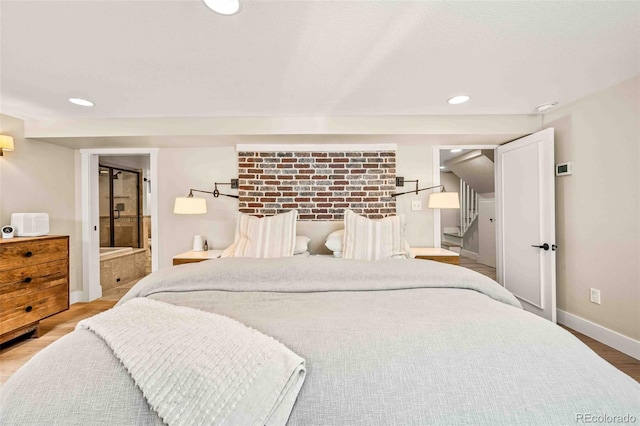 bedroom with baseboards, wood finished floors, and recessed lighting