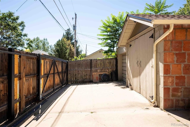 view of patio / terrace with ac unit, a gate, and fence