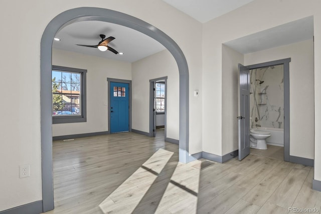 104 Stuart St, Denver, CO 80219 - foyer with arched walkways, baseboards, light wood-type flooring, and recessed lighting