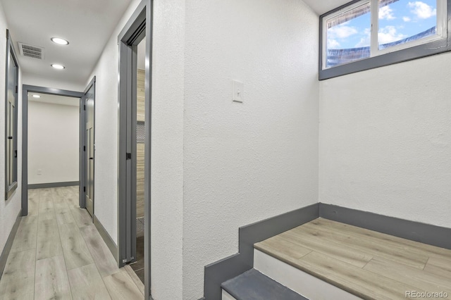 104 Stuart St, Denver, CO 80219 - hallway featuring a textured wall, wood finished floors, recessed lighting, and baseboards