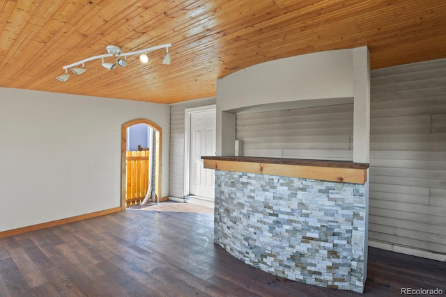 104 Stuart St, Denver, CO 80219 - bar area with wooden ceiling, arched walkways, baseboards, and wood finished floors