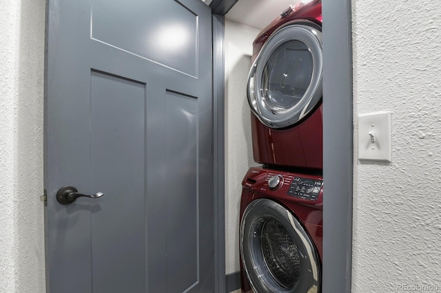 104 Stuart St, Denver, CO 80219 - laundry room with stacked washer / dryer and a textured wall