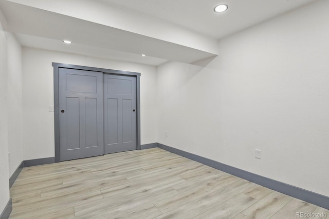 104 Stuart St, Denver, CO 80219 - unfurnished bedroom with light wood-style flooring, baseboards, recessed lighting, and a closet