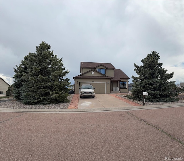 8318 Ivory Loop, Peyton, CO 80831 - traditional-style house with concrete driveway and a garage
