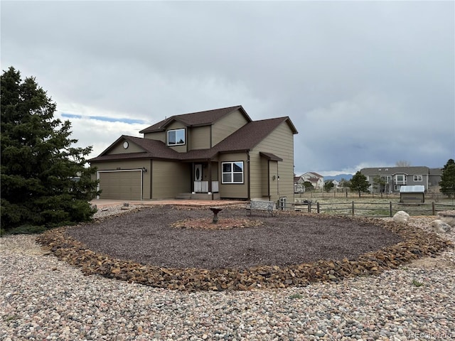 8318 Ivory Loop, Peyton, CO 80831 - traditional-style home with fence, driveway, a garage, and roof with shingles