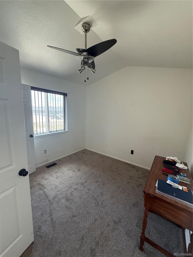 8318 Ivory Loop, Peyton, CO 80831 - unfurnished bedroom with carpet flooring, ceiling fan, vaulted ceiling, and baseboards