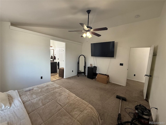 8318 Ivory Loop, Peyton, CO 80831 - unfurnished bedroom featuring vaulted ceiling, carpet floors, baseboards, ceiling fan, and connected bathroom