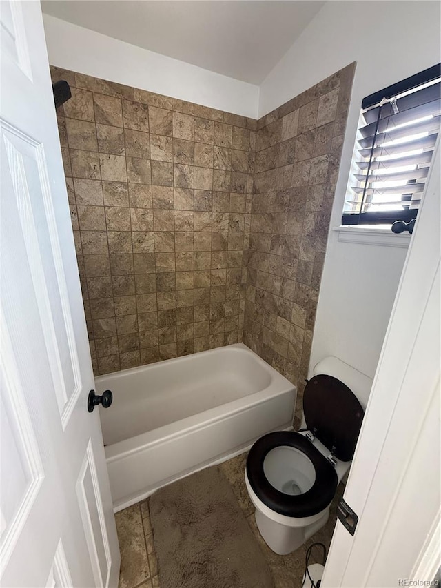 8318 Ivory Loop, Peyton, CO 80831 - bathroom with toilet, shower / bath combination, and lofted ceiling