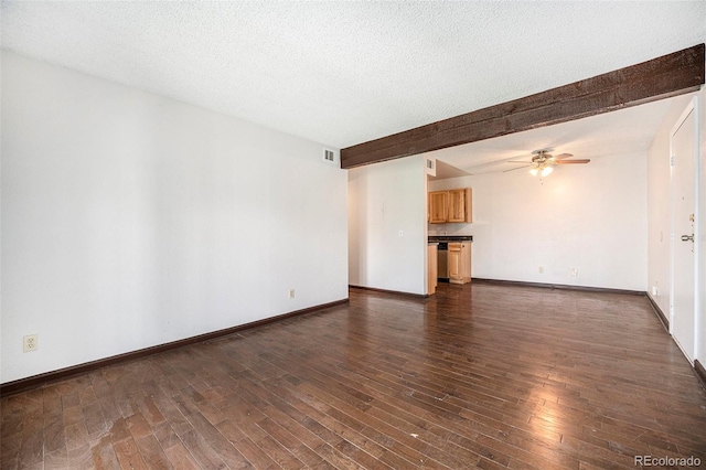 unfurnished living room featuring beam ceiling, visible vents, ceiling fan, dark wood-style floors, and baseboards