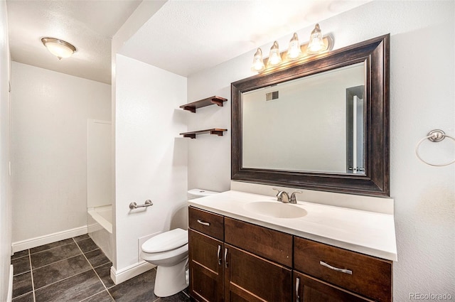 bathroom with toilet, vanity, visible vents, tile patterned flooring, and baseboards