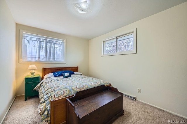 bedroom with baseboards and light carpet