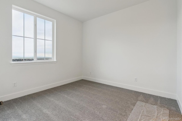 8229 Butte Creek St, Littleton, CO 80125 - carpeted spare room with baseboards