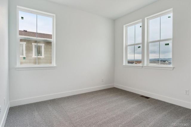 8229 Butte Creek St, Littleton, CO 80125 - carpeted empty room featuring baseboards