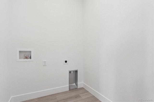 8229 Butte Creek St, Littleton, CO 80125 - clothes washing area featuring electric dryer hookup, hookup for a washing machine, light wood finished floors, and baseboards
