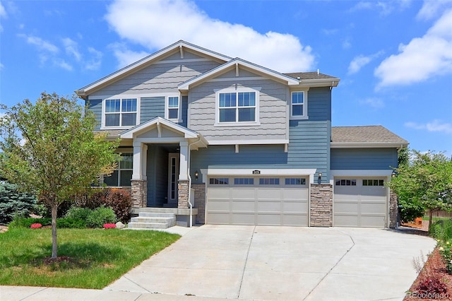 2474 Ravenswood Ct, Longmont, CO 80504 - craftsman house with concrete driveway, stone siding, and an attached garage