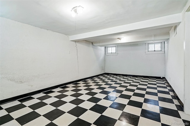 below grade area featuring tile patterned floors