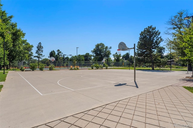 view of basketball court featuring community basketball court and fence