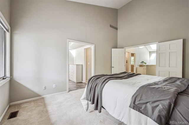 345 Harrison St, Denver, CO 80206 - carpeted bedroom with high vaulted ceiling and baseboards