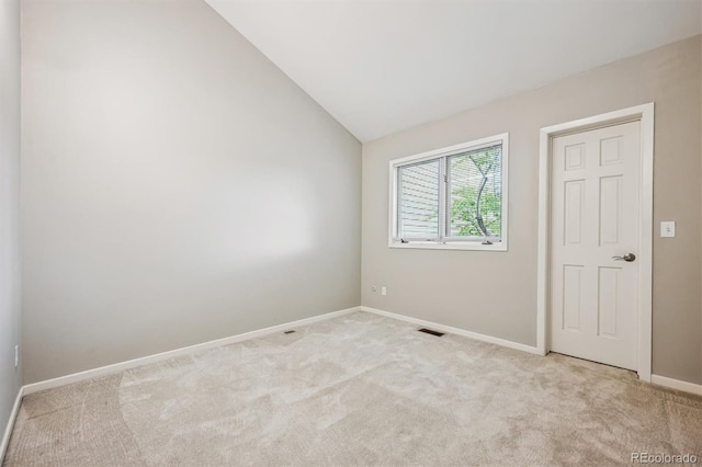 345 Harrison St, Denver, CO 80206 - carpeted spare room with baseboards and vaulted ceiling
