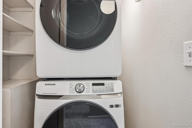 345 Harrison St, Denver, CO 80206 - laundry room featuring stacked washing machine and dryer and a textured wall
