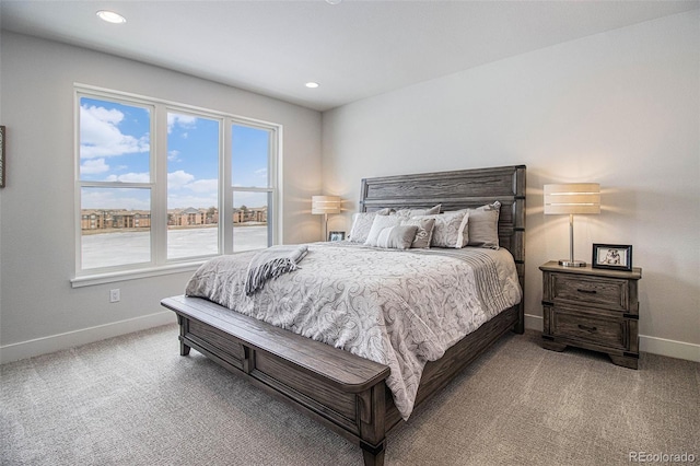 bedroom featuring light carpet