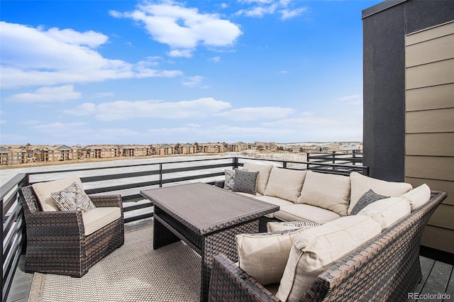 view of terrace with a balcony and outdoor lounge area