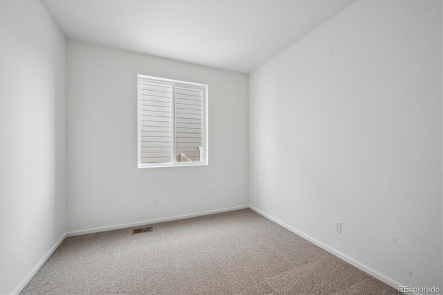 empty room featuring a healthy amount of sunlight and carpet floors