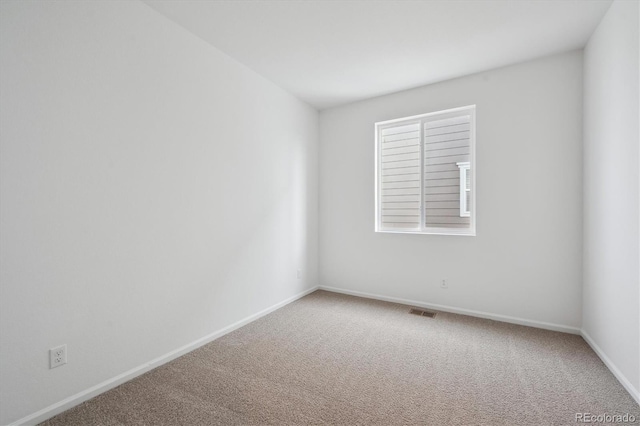 unfurnished room with carpet floors and a healthy amount of sunlight