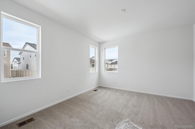 empty room featuring carpet flooring