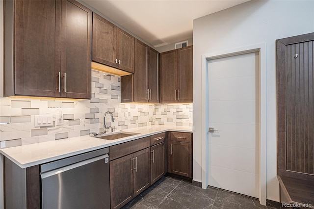 kitchen featuring decorative backsplash, dark brown cabinetry, stainless steel dishwasher, and sink