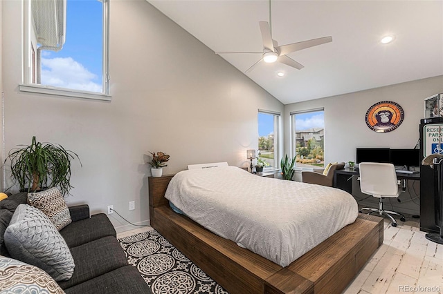 bedroom featuring multiple windows, ceiling fan, vaulted ceiling, and light wood-type flooring