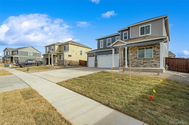 view of front of home with a garage and a front lawn