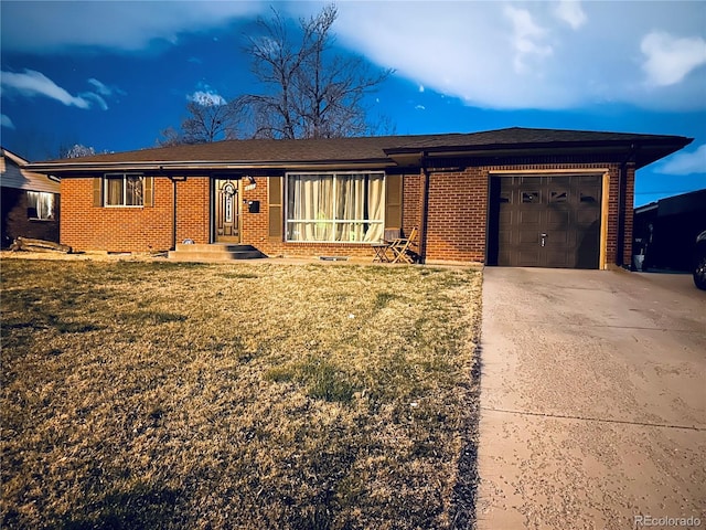 single story home with brick siding, an attached garage, driveway, and a front lawn