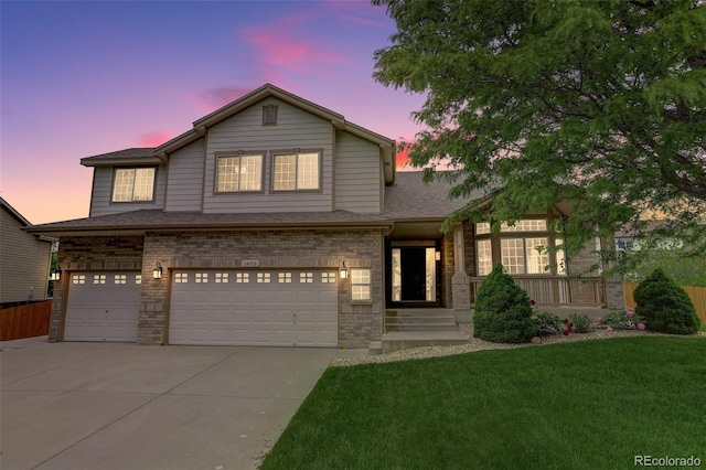 14910 Williams St, Thornton, CO 80602 - view of front of property featuring a garage, concrete driveway, brick siding, and roof with shingles