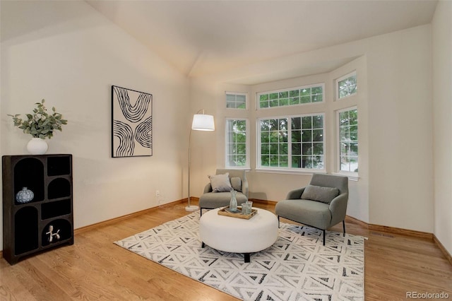 14910 Williams St, Thornton, CO 80602 - living area featuring wood finished floors, baseboards, and vaulted ceiling