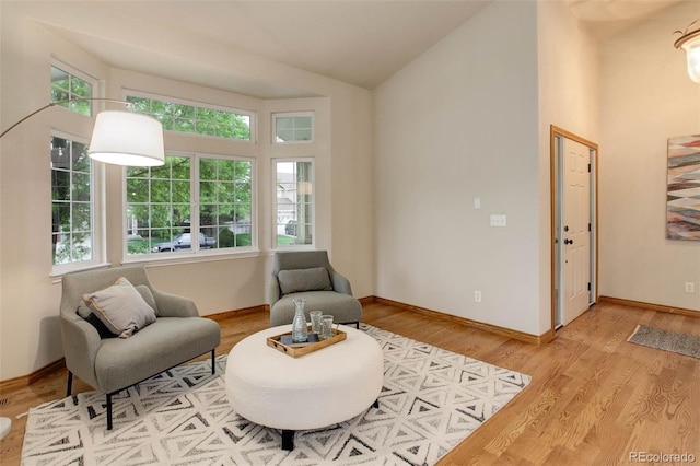14910 Williams St, Thornton, CO 80602 - sitting room featuring lofted ceiling, wood finished floors, and baseboards