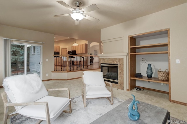 14910 Williams St, Thornton, CO 80602 - living area featuring ceiling fan, a tile fireplace, light colored carpet, baseboards, and lofted ceiling