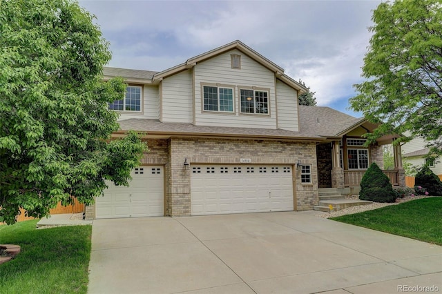 14910 Williams St, Thornton, CO 80602 - view of front facade featuring an attached garage, concrete driveway, roof with shingles, and brick siding