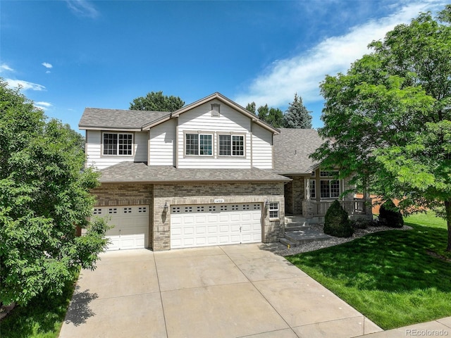 14910 Williams St, Thornton, CO 80602 - view of front of house featuring an attached garage, driveway, roof with shingles, and a front lawn